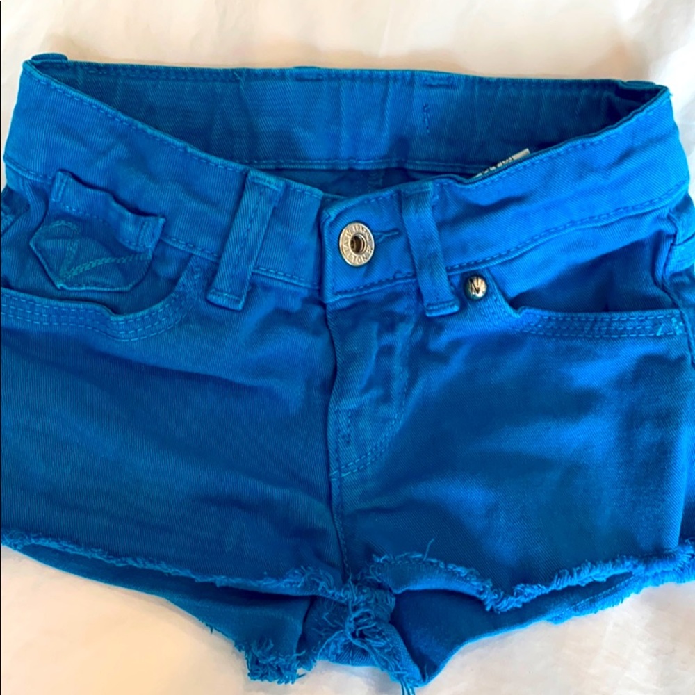 Cutoff shorts in a bright, royal blue shorts